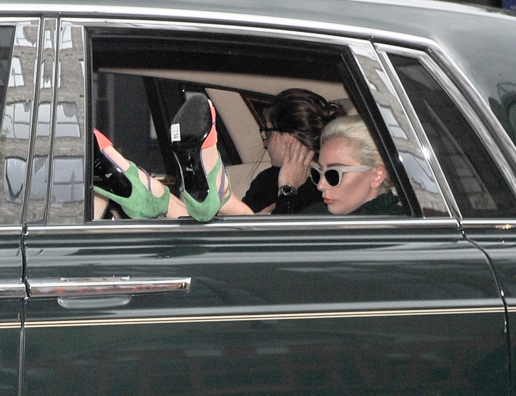 Lady Gaga is seen leaving the yoga studio in London in a car with her colorful heels out the window. Photo courtesy of Splash News