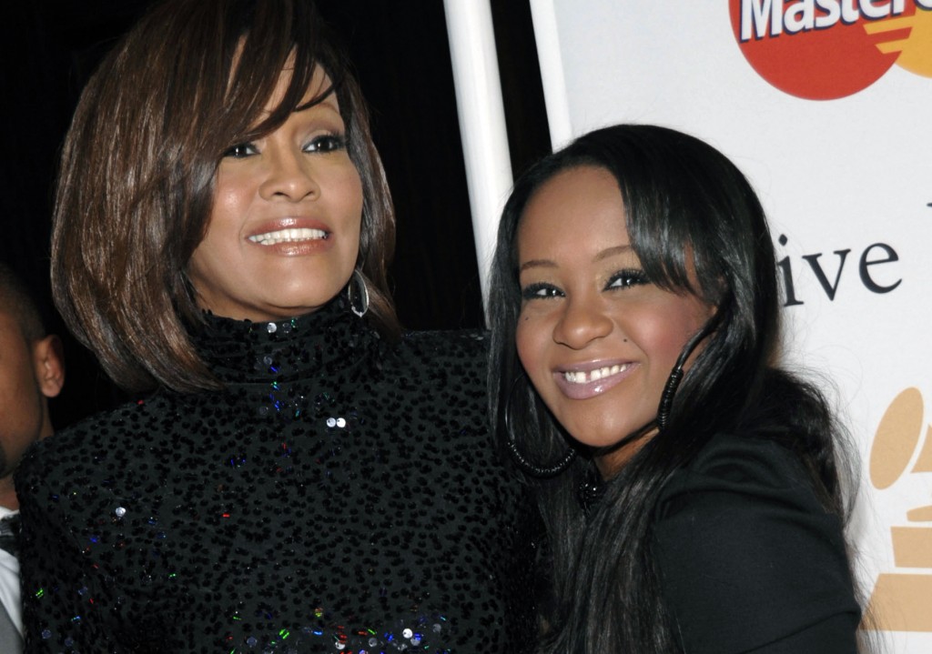 Singer Whitney Houston (left) and daughter Bobbi Kristina Brown arrived at an event together in Beverly Hills, CA, back in 2011. (Photo courtesy AP Photo/Dan Steinberg)