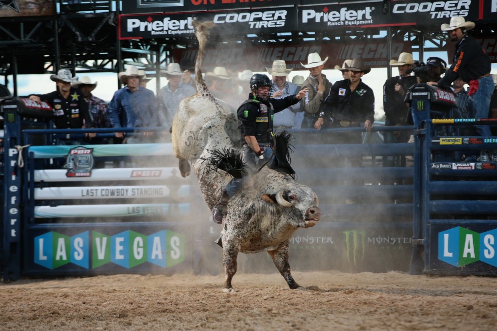 Reese Cates rides Jeff Robinson's Mac-Nett's Southern Wine for 83 during the second round of the Las Vegas Last Cowboy Standing Built Ford Tough series PBR. Photo by Andy Watson.