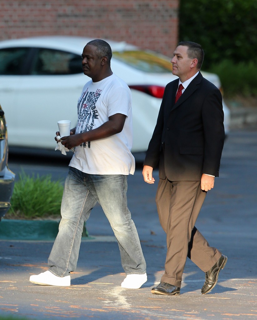 Tommy Brown, Bobby Brown's brother being escorted by a detective from the Peachtree Christian Hospice after trying to see Bobbi Kristina in Georgia.