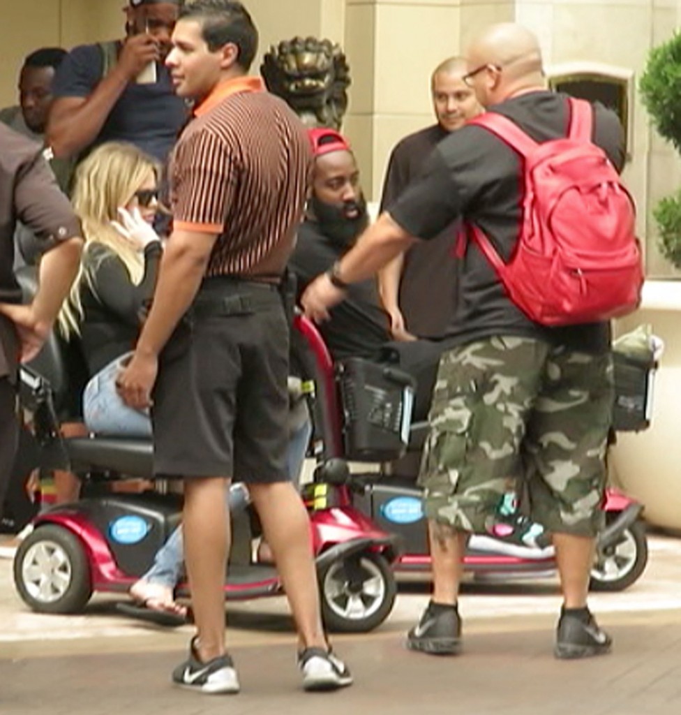 Khloe Kardashian and James Harden ide motor carts together while leaving their Las Vegas luxury hotel together on July 4 weekend. (Photo credit: Splash)