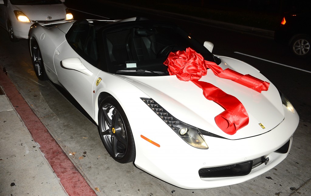 Tyga Gifts Kylie Jenner With a Brand New Ferrari at Bootsy Bellows Pictured: Tyga, Kylie Jenner Ref: SPL1098716  100815   Picture by: All Access Photo Group Splash News and Pictures Los Angeles:310-821-2666 New York:212-619-2666 London:870-934-2666 photodesk@splashnews.com 