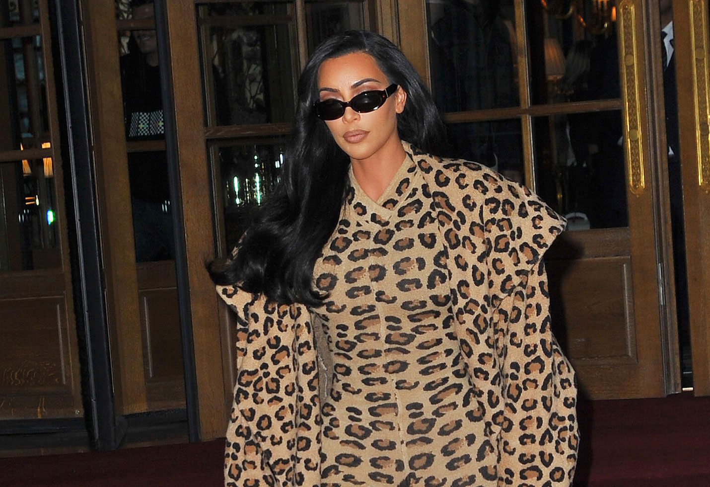 Kim Kardashian Returns To Paris In Leopard Catsuit With Heavy Security